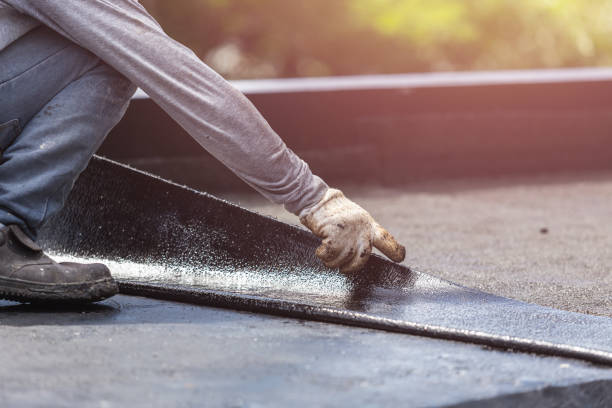 Professional Basement Waterproofing technician working in Rio, VA